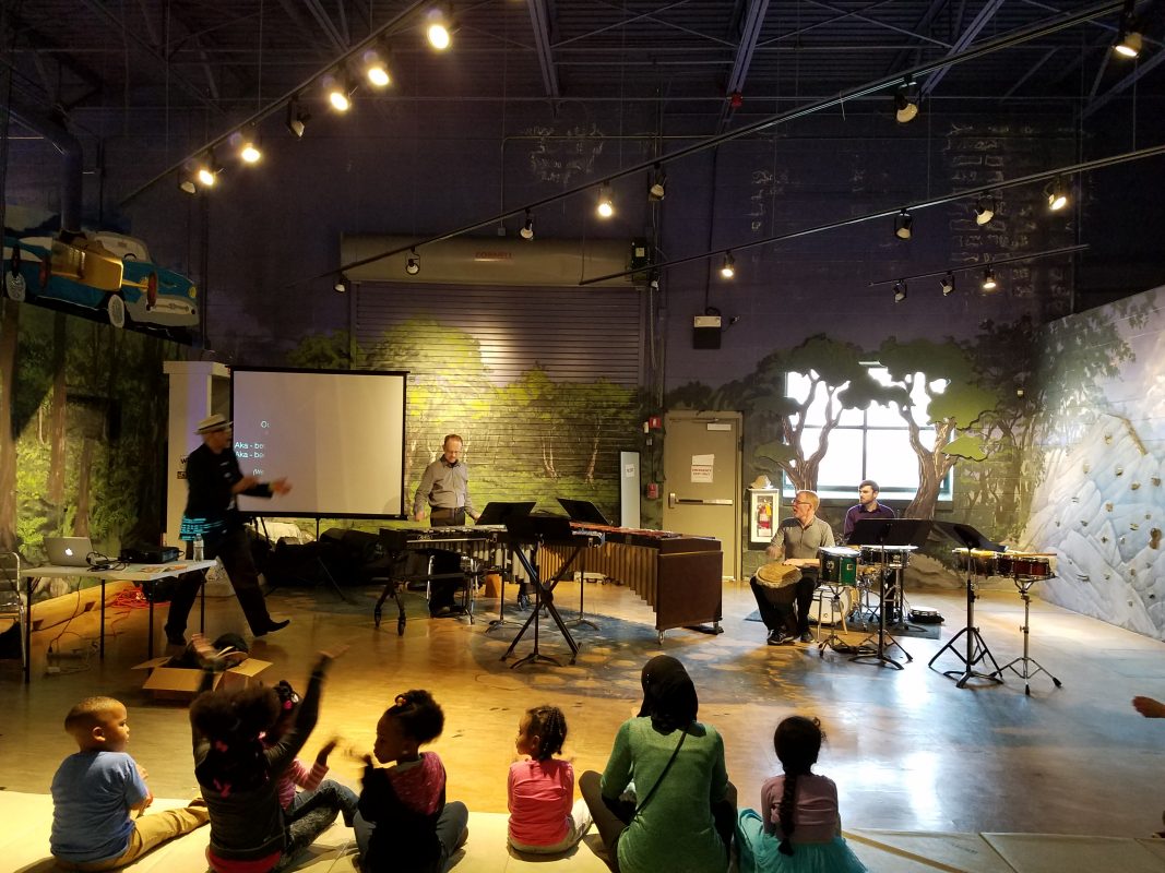 The percussion ensemble plays an orKIDStra concert.